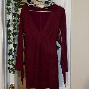 tight tassel dress with deep plunging neckline 👗